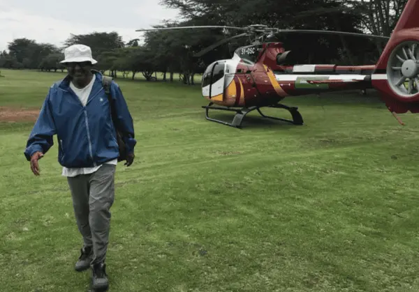 Rashid mirmohamed walking from helicopter in kenya